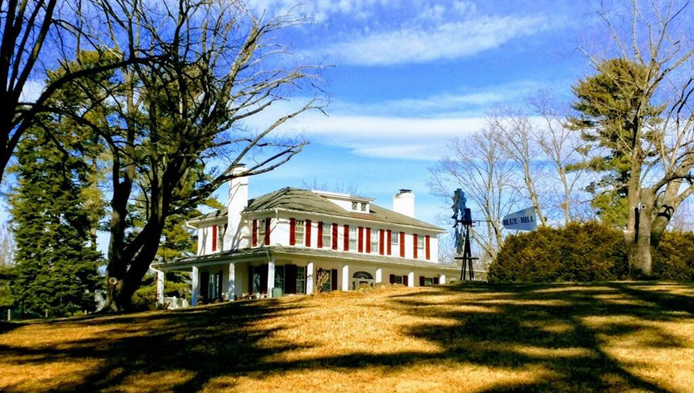 Idyllic photo of a farmhouse on a hill