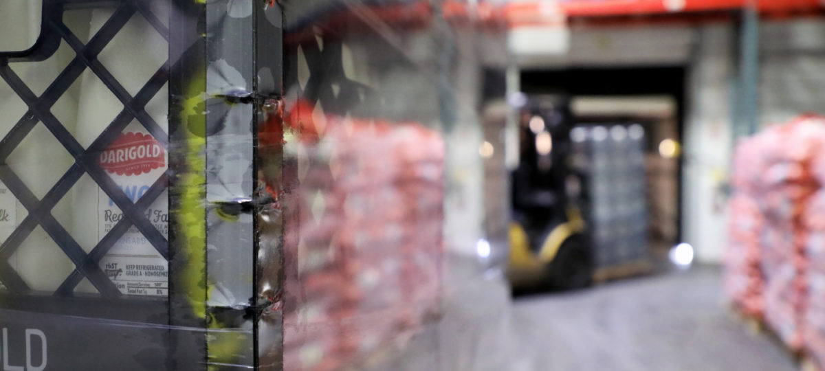 Crates of milk in a giant warehouse