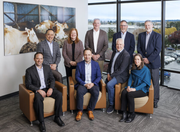 A group of executives pose for the camera