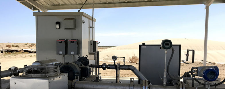 Industrial equipment covered by a metal roof in the desert