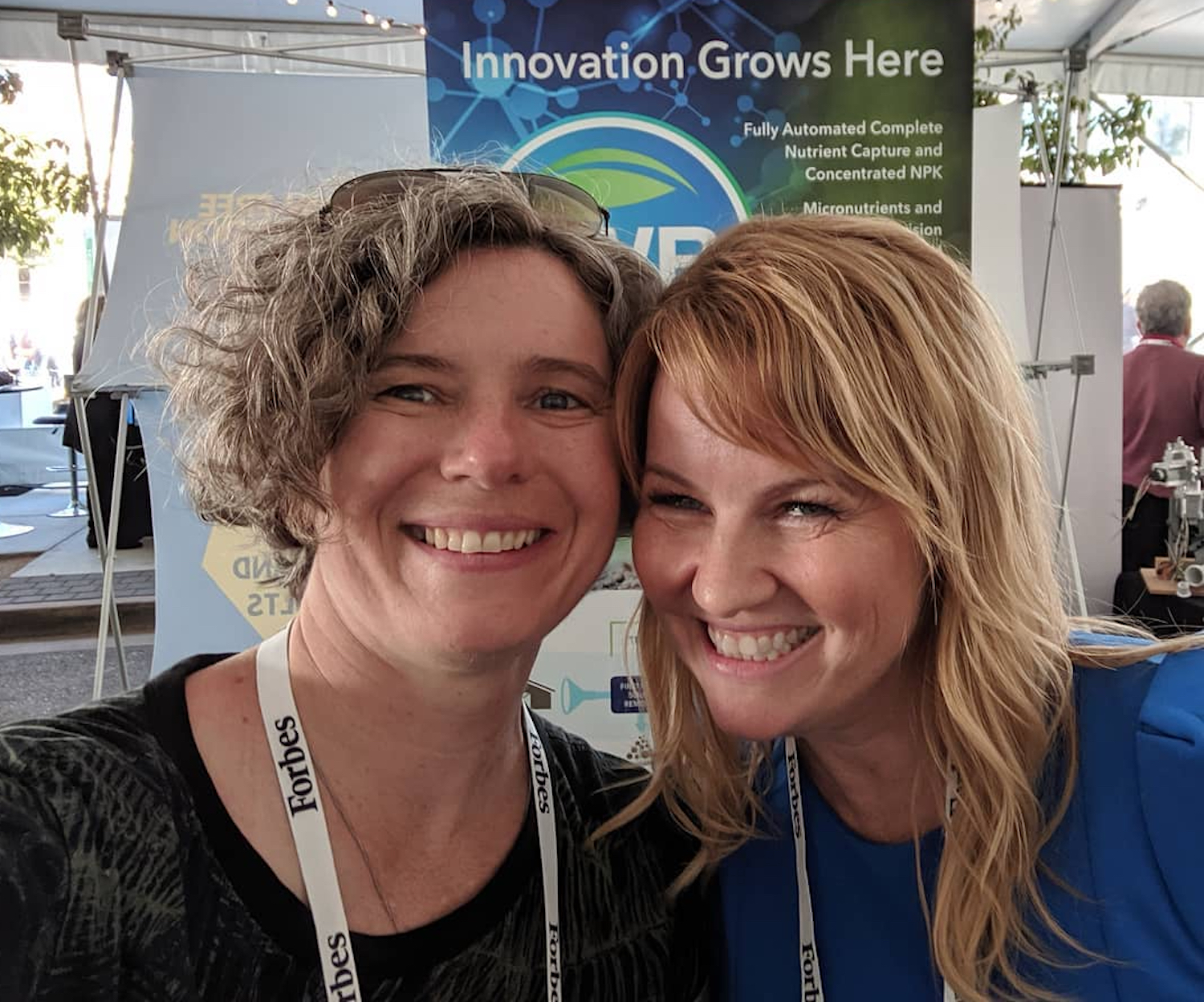 Two women take a selfie and a startup tech pitch summit