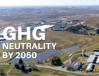 Aerial image of a dairy farm and landscape with GHG Neutrality by 2020 text overlay