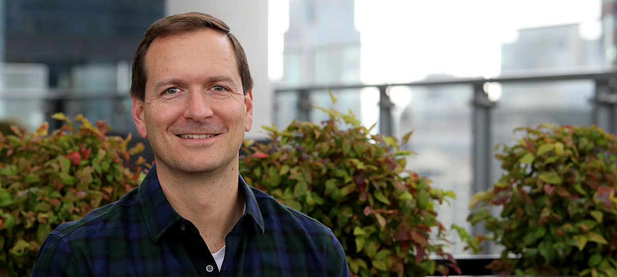 Portrait of man with city background