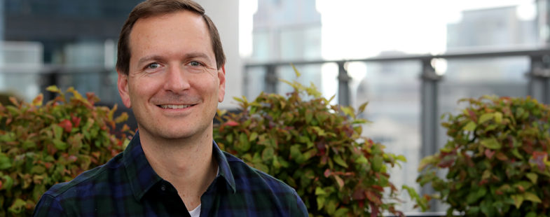 Portrait of man with city background