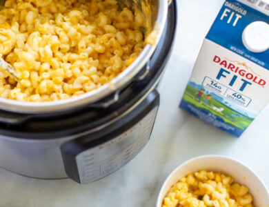 Instant pot with Mac and cheese plus a bowl and carton of Darigold FIT milk