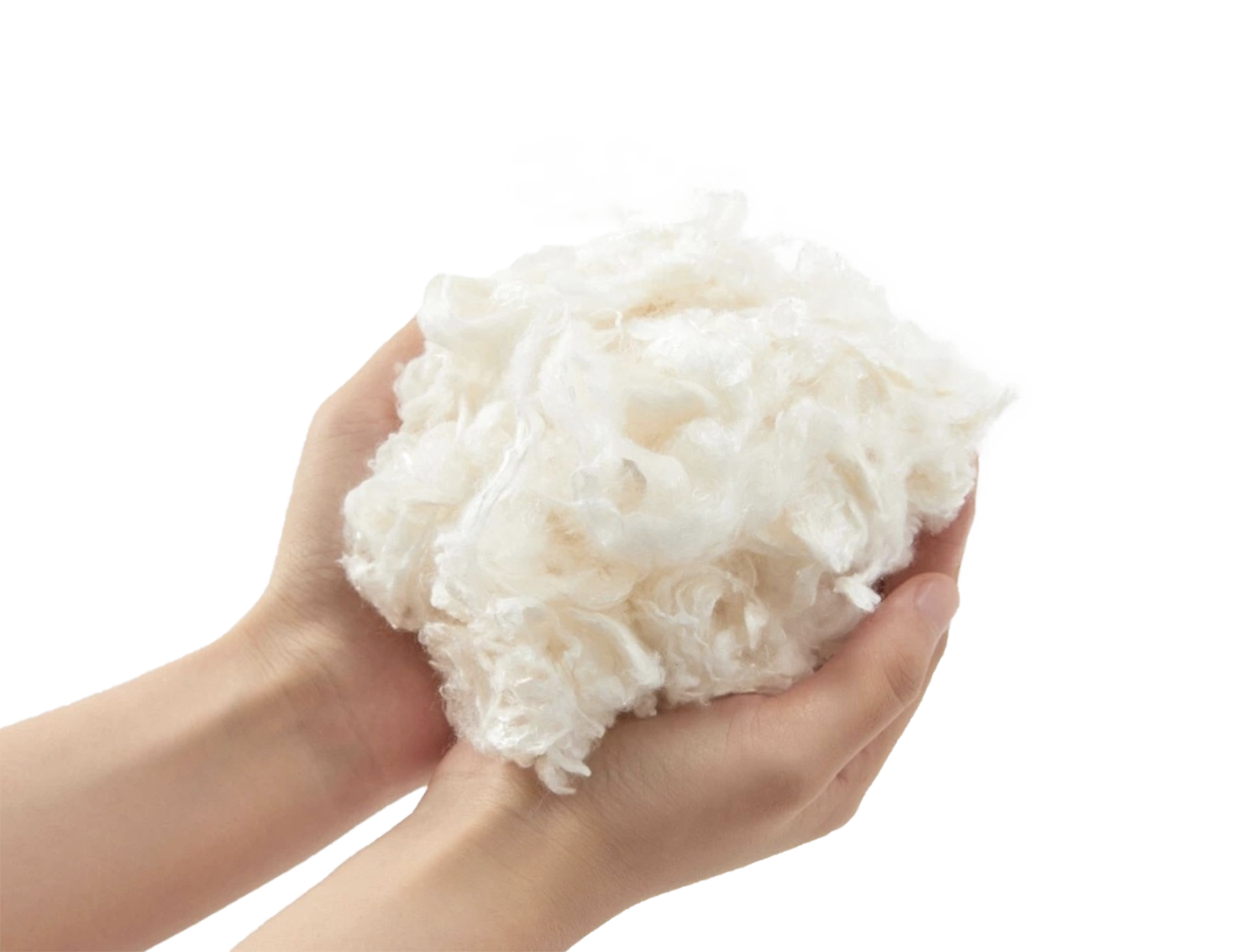 A woman holds a handful of fluffy white fibers made with milk