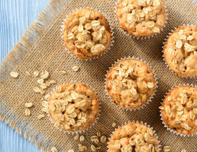 Oatmeal muffins arranged on natural fiber and blue wood table