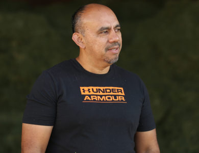 A man standing in front of animal feed