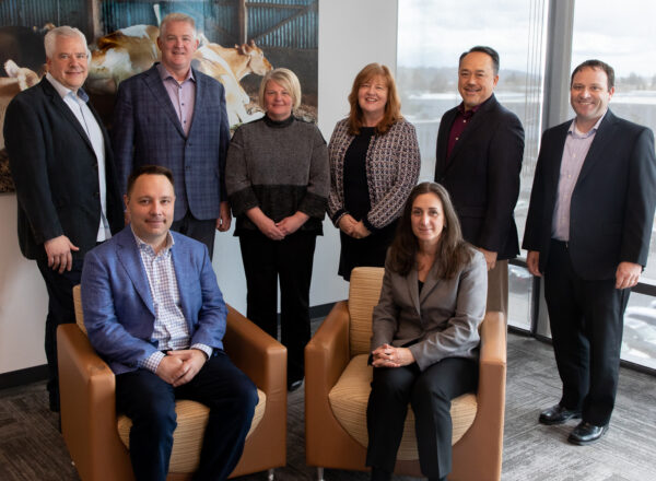 A group of executives pose for the camera