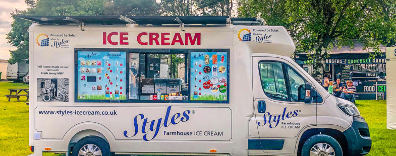 A solar-powered ice cream van on green grass