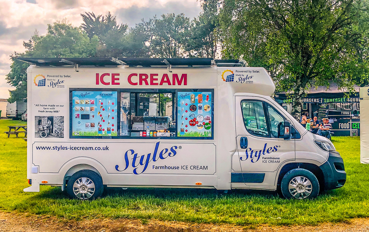 A solar-powered ice cream van on green grass