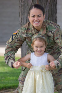 A woman in army uniform with her daughter