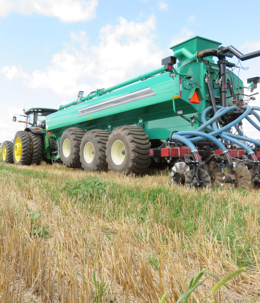 Large agricultural equipment used to spread nutrients on crops