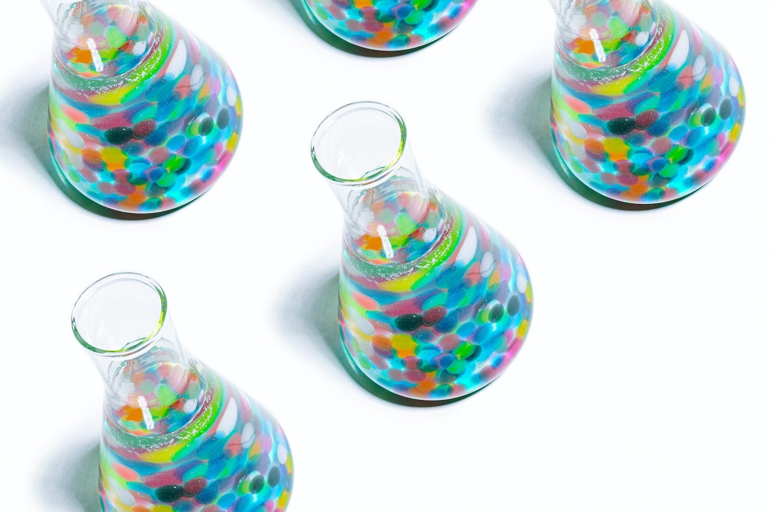 Several large test tubes filled with multi-colored bubbles
