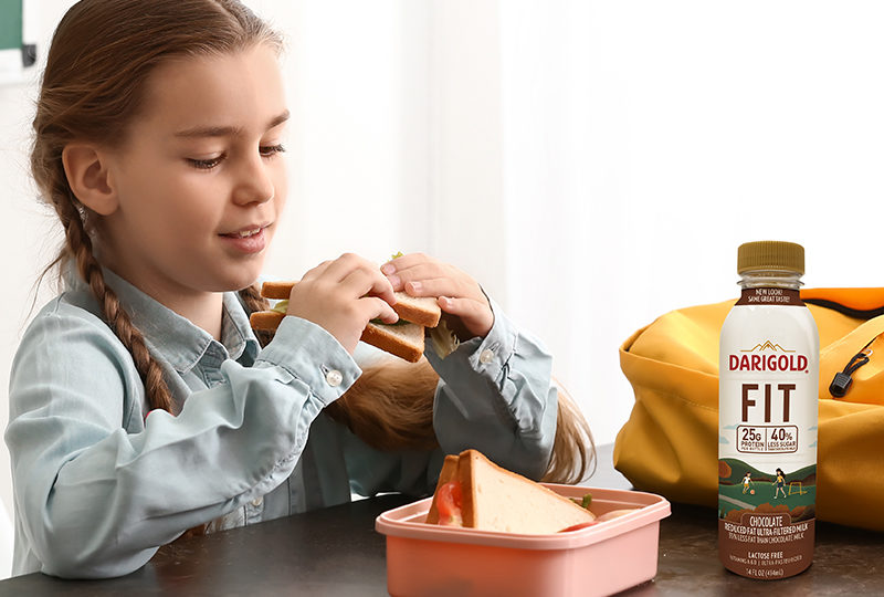 Girl sitting down to lunch